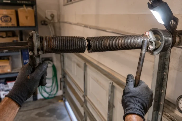 Torsion spring repair technician close-up