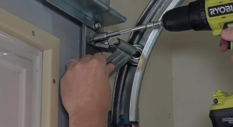 Technician repairing a garage door opener