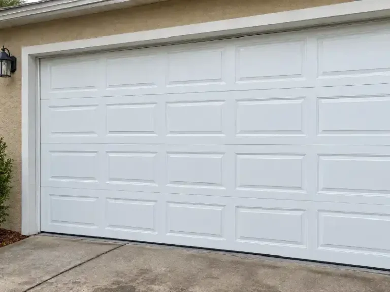Replaced garage door panel matching original door color in Southwood